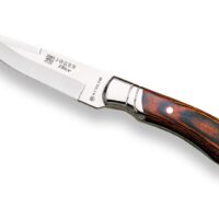 CUCHILLO DE CAZADOR CON VIROLA CACHAS EN MADERA ROJA PRENSADA Y HOJA DE 12 CM.